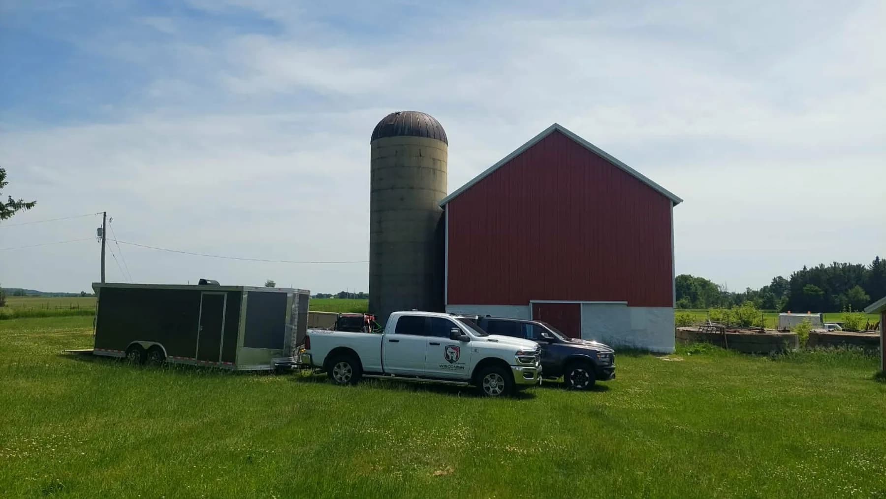 Drone and support equipment set up beside an agricultural field