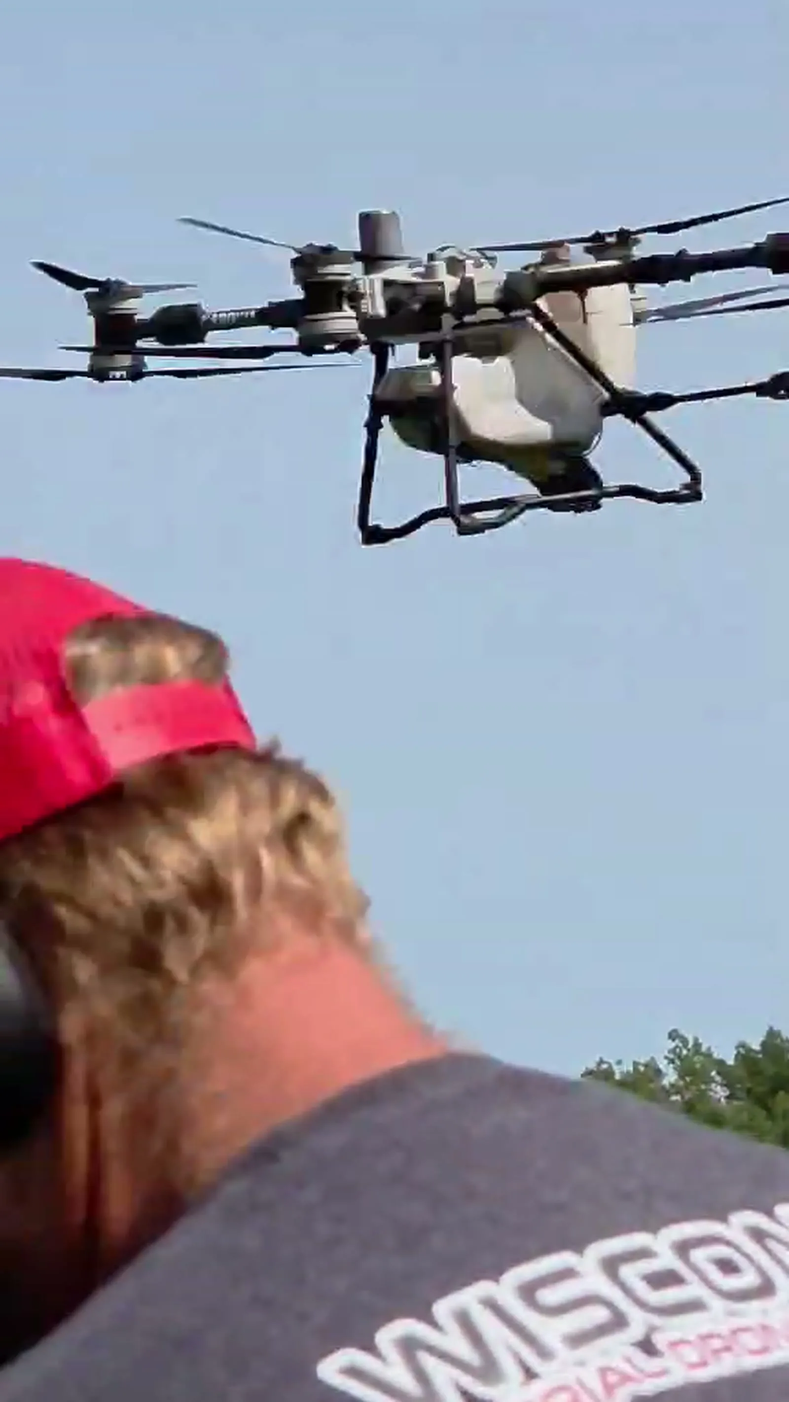 Agriculture drone flying above a planted field